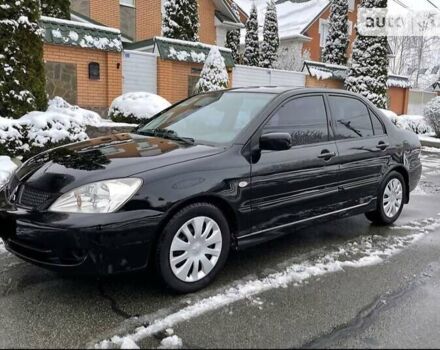 Чорний Міцубісі Lancer, об'ємом двигуна 1.58 л та пробігом 230 тис. км за 4900 $, фото 12 на Automoto.ua