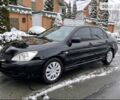 Чорний Міцубісі Lancer, об'ємом двигуна 1.58 л та пробігом 230 тис. км за 4900 $, фото 12 на Automoto.ua