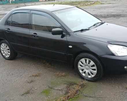 Черный Мицубиси Лансер, объемом двигателя 1.6 л и пробегом 230 тыс. км за 3250 $, фото 1 на Automoto.ua