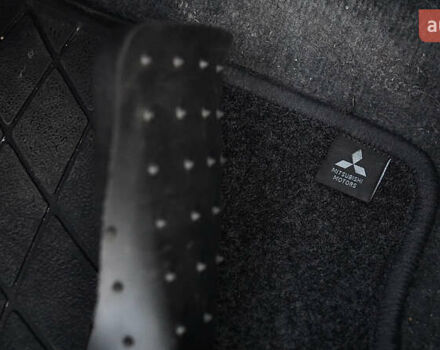 Черный Мицубиси Лансер, объемом двигателя 2 л и пробегом 253 тыс. км за 6900 $, фото 14 на Automoto.ua