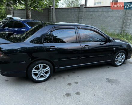 Черный Мицубиси Лансер, объемом двигателя 2 л и пробегом 255 тыс. км за 5000 $, фото 10 на Automoto.ua