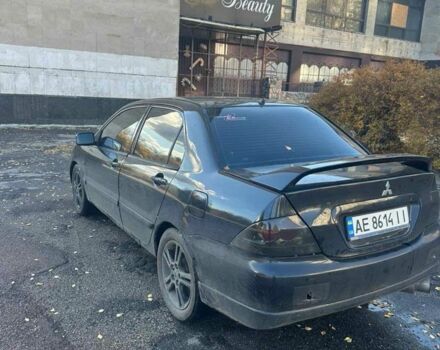 Черный Мицубиси Лансер, объемом двигателя 2 л и пробегом 200 тыс. км за 2999 $, фото 4 на Automoto.ua
