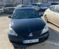 Черный Мицубиси Лансер, объемом двигателя 1.6 л и пробегом 340 тыс. км за 2200 $, фото 1 на Automoto.ua