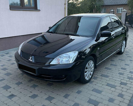 Чорний Міцубісі Lancer, об'ємом двигуна 1.6 л та пробігом 170 тис. км за 4900 $, фото 5 на Automoto.ua