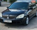 Черный Мицубиси Лансер, объемом двигателя 1.58 л и пробегом 324 тыс. км за 3800 $, фото 1 на Automoto.ua