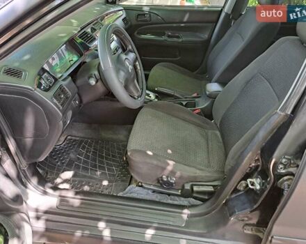 Чорний Міцубісі Lancer, об'ємом двигуна 1.58 л та пробігом 280 тис. км за 3950 $, фото 13 на Automoto.ua