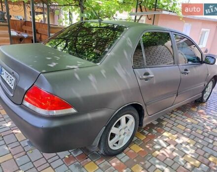 Чорний Міцубісі Lancer, об'ємом двигуна 1.58 л та пробігом 280 тис. км за 3950 $, фото 4 на Automoto.ua