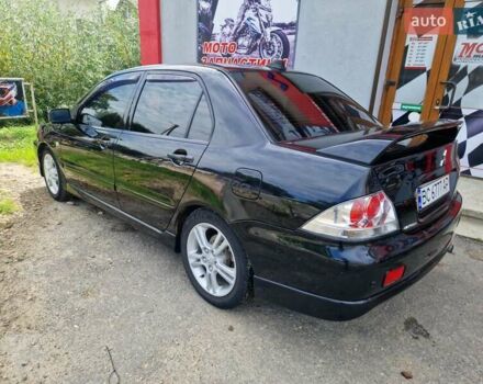 Черный Мицубиси Лансер, объемом двигателя 2 л и пробегом 168 тыс. км за 4999 $, фото 10 на Automoto.ua