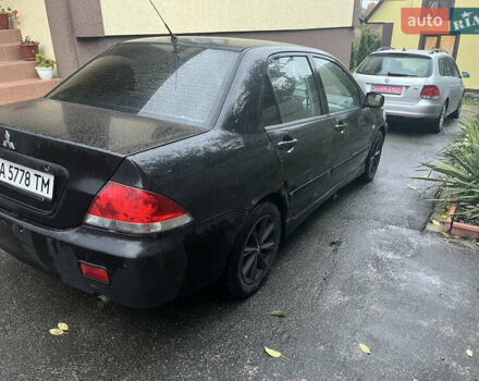 Черный Мицубиси Лансер, объемом двигателя 1.58 л и пробегом 250 тыс. км за 2450 $, фото 3 на Automoto.ua