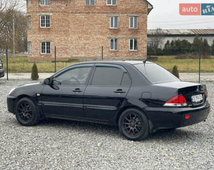 Чорний Міцубісі Lancer, об'ємом двигуна 1.58 л та пробігом 230 тис. км за 3350 $, фото 11 на Automoto.ua