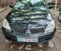 Чорний Міцубісі Lancer, об'ємом двигуна 1.58 л та пробігом 276 тис. км за 4200 $, фото 1 на Automoto.ua