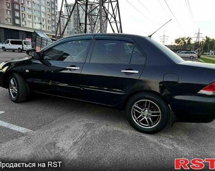 Чорний Міцубісі Lancer, об'ємом двигуна 1.6 л та пробігом 329 тис. км за 3500 $, фото 4 на Automoto.ua