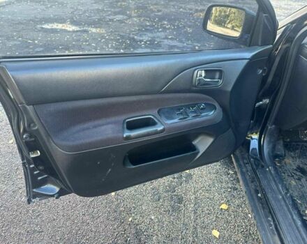 Черный Мицубиси Лансер, объемом двигателя 2 л и пробегом 200 тыс. км за 2999 $, фото 6 на Automoto.ua