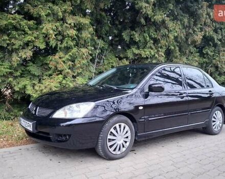 Черный Мицубиси Лансер, объемом двигателя 1.58 л и пробегом 246 тыс. км за 4200 $, фото 3 на Automoto.ua