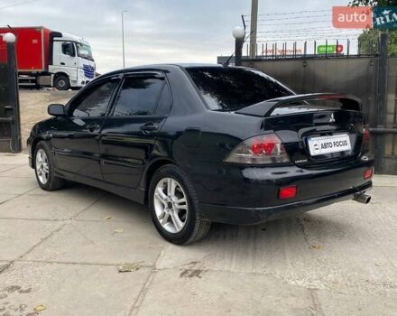 Чорний Міцубісі Lancer, об'ємом двигуна 2 л та пробігом 248 тис. км за 4990 $, фото 4 на Automoto.ua