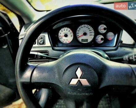Чорний Міцубісі Lancer, об'ємом двигуна 1.6 л та пробігом 179 тис. км за 4600 $, фото 7 на Automoto.ua