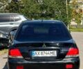 Черный Мицубиси Лансер, объемом двигателя 1.6 л и пробегом 230 тыс. км за 3200 $, фото 2 на Automoto.ua