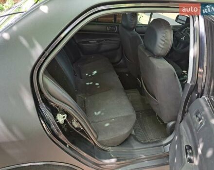 Чорний Міцубісі Lancer, об'ємом двигуна 1.58 л та пробігом 280 тис. км за 3950 $, фото 20 на Automoto.ua