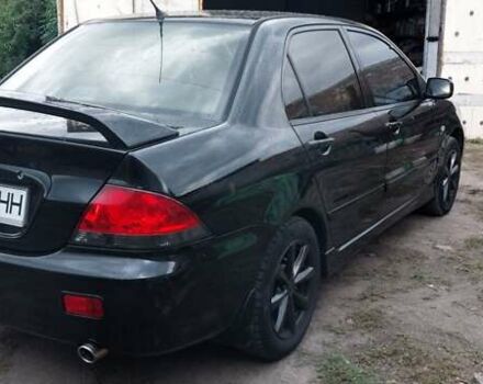 Чорний Міцубісі Lancer, об'ємом двигуна 1.59 л та пробігом 185 тис. км за 4900 $, фото 8 на Automoto.ua
