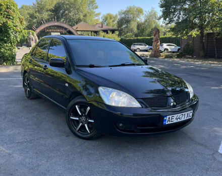 Чорний Міцубісі Lancer, об'ємом двигуна 1.58 л та пробігом 205 тис. км за 4700 $, фото 4 на Automoto.ua