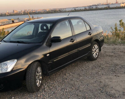 Черный Мицубиси Лансер, объемом двигателя 1.58 л и пробегом 161 тыс. км за 4800 $, фото 2 на Automoto.ua