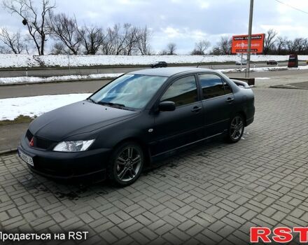 Чорний Міцубісі Lancer, об'ємом двигуна 2 л та пробігом 270 тис. км за 4499 $, фото 1 на Automoto.ua