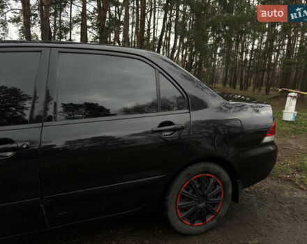 Чорний Міцубісі Lancer, об'ємом двигуна 1.58 л та пробігом 210 тис. км за 3900 $, фото 8 на Automoto.ua