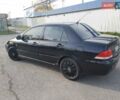 Чорний Міцубісі Lancer, об'ємом двигуна 1.58 л та пробігом 290 тис. км за 3200 $, фото 4 на Automoto.ua