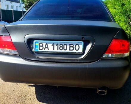 Чорний Міцубісі Lancer, об'ємом двигуна 1.6 л та пробігом 211 тис. км за 3500 $, фото 4 на Automoto.ua