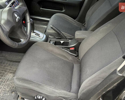 Чорний Міцубісі Lancer, об'ємом двигуна 1.58 л та пробігом 386 тис. км за 4450 $, фото 11 на Automoto.ua