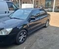 Черный Мицубиси Лансер, объемом двигателя 1.58 л и пробегом 260 тыс. км за 3250 $, фото 1 на Automoto.ua