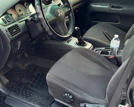 Черный Мицубиси Лансер, объемом двигателя 1.59 л и пробегом 221 тыс. км за 4200 $, фото 9 на Automoto.ua