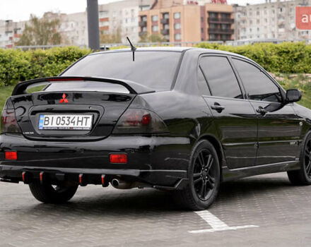 Черный Мицубиси Лансер, объемом двигателя 2 л и пробегом 253 тыс. км за 6900 $, фото 2 на Automoto.ua