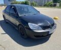 Чорний Міцубісі Lancer, об'ємом двигуна 1.6 л та пробігом 243 тис. км за 2999 $, фото 1 на Automoto.ua