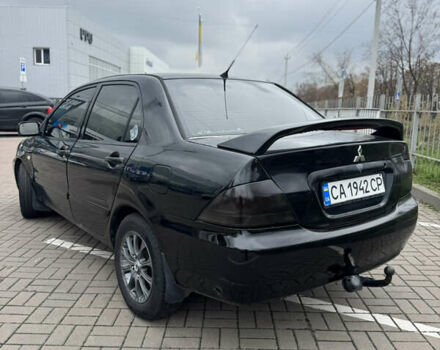 Черный Мицубиси Лансер, объемом двигателя 1.58 л и пробегом 370 тыс. км за 3500 $, фото 3 на Automoto.ua