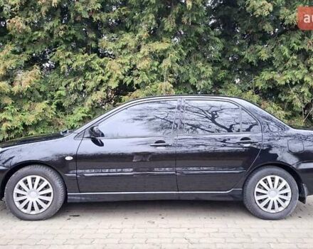 Черный Мицубиси Лансер, объемом двигателя 1.58 л и пробегом 246 тыс. км за 4200 $, фото 2 на Automoto.ua