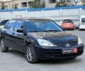 Черный Мицубиси Лансер, объемом двигателя 1.6 л и пробегом 280 тыс. км за 4490 $, фото 2 на Automoto.ua