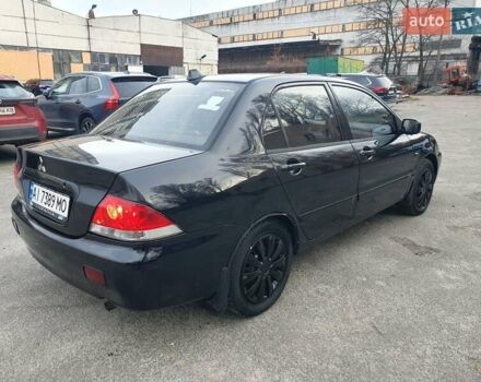 Черный Мицубиси Лансер, объемом двигателя 1.58 л и пробегом 222 тыс. км за 2999 $, фото 5 на Automoto.ua