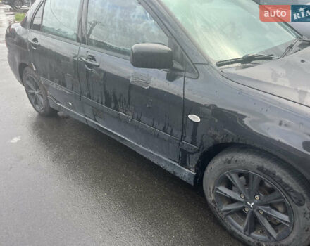Чорний Міцубісі Lancer, об'ємом двигуна 1.58 л та пробігом 257 тис. км за 2400 $, фото 4 на Automoto.ua