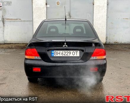 Чорний Міцубісі Lancer, об'ємом двигуна 1.6 л та пробігом 160 тис. км за 4500 $, фото 4 на Automoto.ua