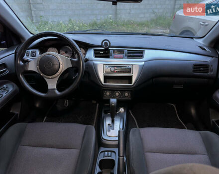 Черный Мицубиси Лансер, объемом двигателя 2 л и пробегом 255 тыс. км за 5000 $, фото 6 на Automoto.ua