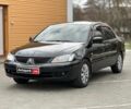 Черный Мицубиси Лансер, объемом двигателя 1.6 л и пробегом 262 тыс. км за 4790 $, фото 1 на Automoto.ua