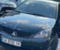 Чорний Міцубісі Lancer, об'ємом двигуна 2 л та пробігом 271 тис. км за 3900 $, фото 1 на Automoto.ua