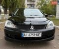Чорний Міцубісі Lancer, об'ємом двигуна 1.58 л та пробігом 386 тис. км за 4450 $, фото 1 на Automoto.ua