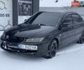 Черный Мицубиси Лансер, объемом двигателя 1.6 л и пробегом 200 тыс. км за 3200 $, фото 1 на Automoto.ua