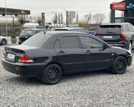 Чорний Міцубісі Lancer, об'ємом двигуна 1.58 л та пробігом 230 тис. км за 3350 $, фото 7 на Automoto.ua