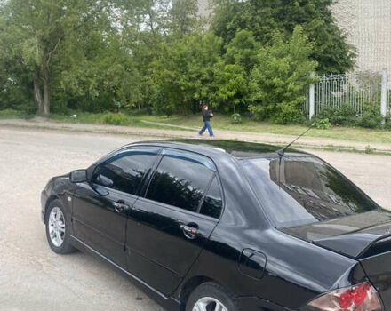 Чорний Міцубісі Lancer, об'ємом двигуна 2 л та пробігом 183 тис. км за 4500 $, фото 11 на Automoto.ua