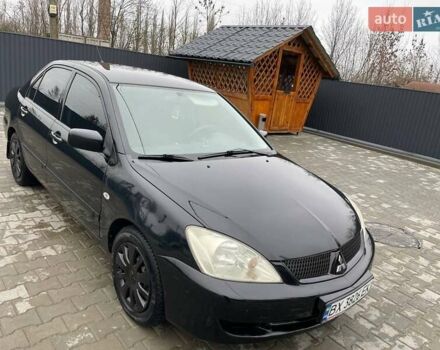 Чорний Міцубісі Lancer, об'ємом двигуна 1.58 л та пробігом 282 тис. км за 4100 $, фото 6 на Automoto.ua