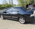 Чорний Міцубісі Lancer, об'ємом двигуна 2 л та пробігом 240 тис. км за 5600 $, фото 1 на Automoto.ua