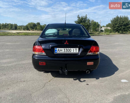 Чорний Міцубісі Lancer, об'ємом двигуна 1.58 л та пробігом 236 тис. км за 4500 $, фото 3 на Automoto.ua